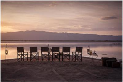 Sundowners on the edge of Lake Burunge