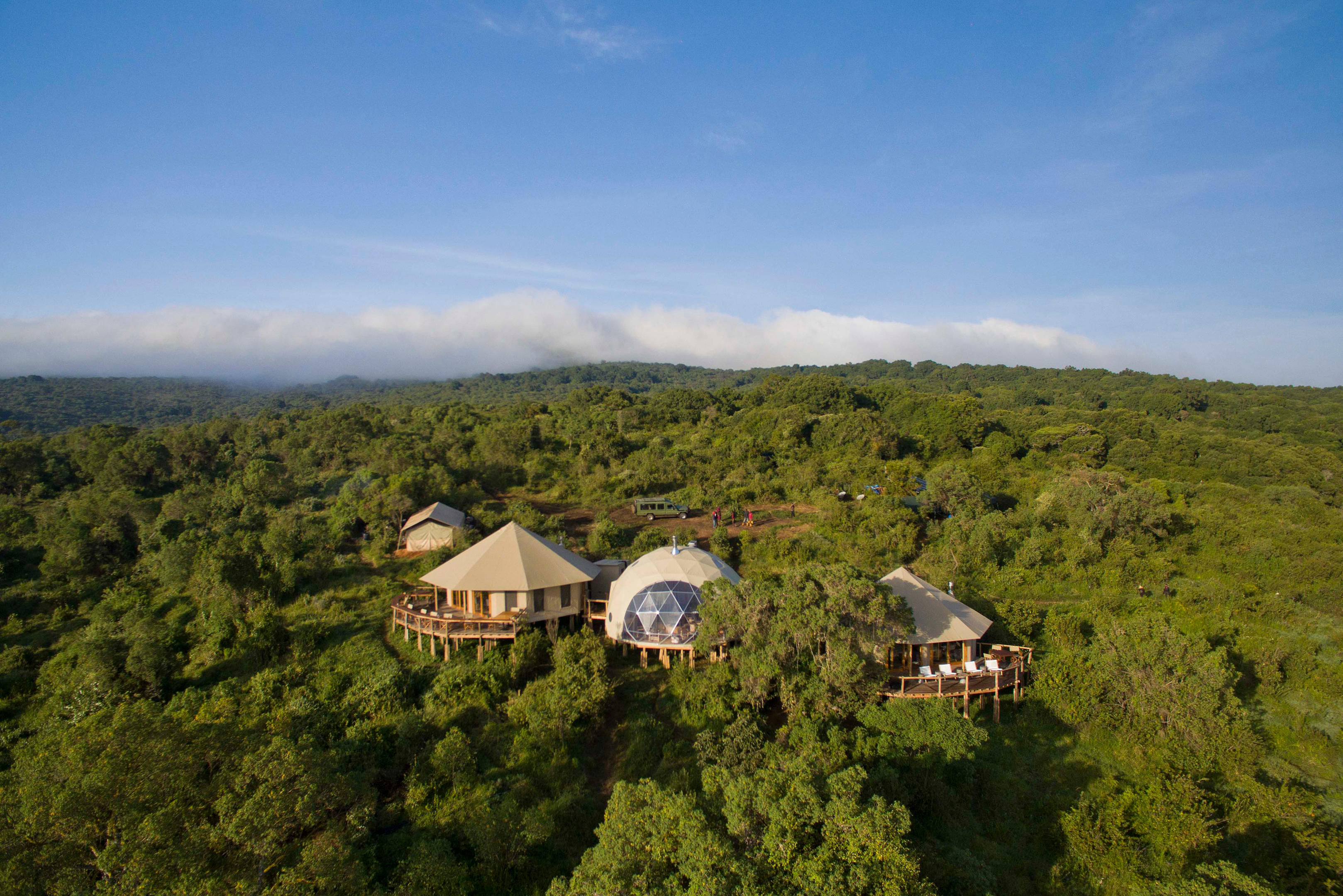 Aerial view of The Highlands dome tents nestled in the Ngorongoro Crater rim forest, Tanzania